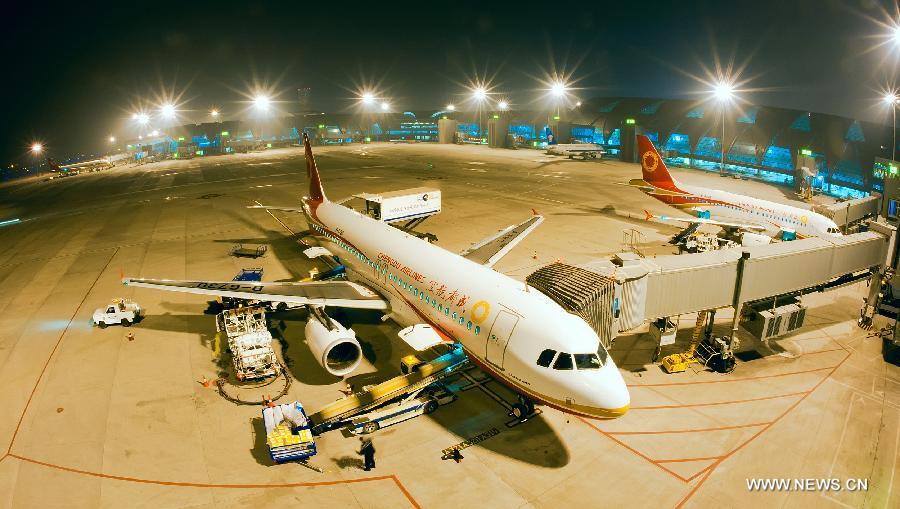 Photo taken on Nov. 12, 2012 shows the night scene of Shuangliu International Airport in Chengdu, capital of southwest China's Sichuan Province. By the end of 2012, Chengdu's GDP has reached 800 billion RMB (about 130.48 billion U.S. dollars), ranking the 3rd place in China's sub-provincial cities. By May of 2013, more than 230 enterprises in the Fortune 500 have come to Chengdu. The 2013 Fortune Global Forum will be held in Chengdu from June 6 to June 8. Chengdu, an ancient city with a history of over 2,300 year, is developing into an international metropolis with its huge economic development potential as well as its special cultural environment. (Xinhua)