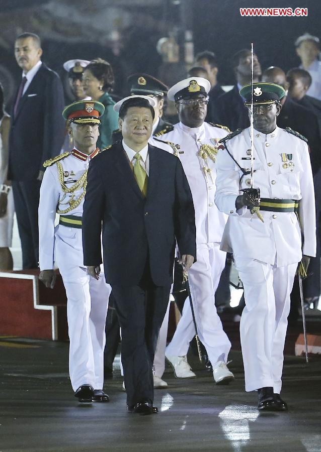 Chinese President Xi Jinping (L Front) reviews an honor guard during a welcoming ceremony held for him in Port of Spain, capital of Trinidad and Tobago, May 31, 2013. Xi arrived in Port of Spain Friday to start a state visit to Trinidad and Tobago. (Xinhua/Yao Dawei) 