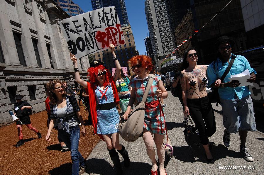 Participants march during a 2013 SlutWalk rally against sexual discrimination or inequality in Vancouver, Canada, on June 2, 2013. Slutwalk is a movement across the world, calling for equal rights for sex and genders' respect, which was provoked after a policeman advised young women to "avoid dressing like sluts" in Canada in April 2011. (Xinhua/Sergei Bachlakov) 