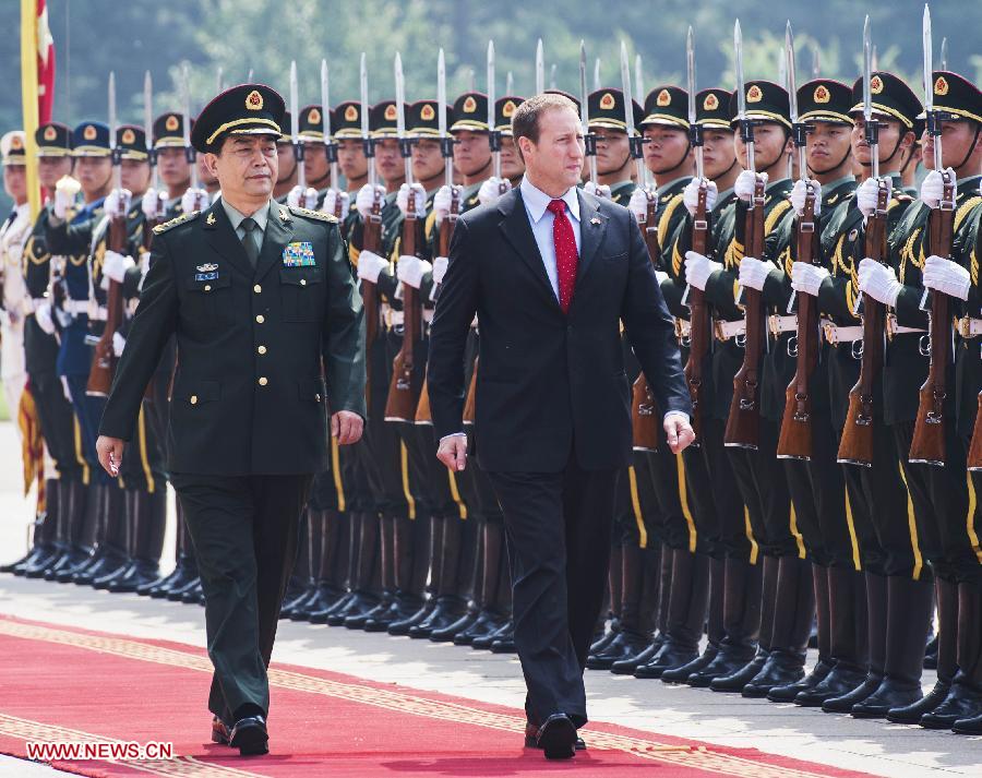 Chinese State Councilor and Defense Minister Chang Wanquan (L, front) and visiting Canadian Minister of National Defence Peter MacKay (R, front) inspect the guard of honor during a welcoming ceremony in Beijing, capital of China, June 3, 2013. (Xinhua/Wang Ye)