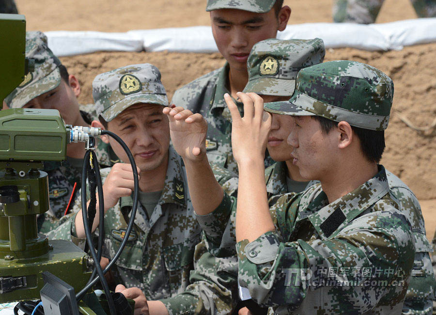 Cadets who will graduate from Langfang Barrack of Nanjing Artillery Academy of the Chinese People's Liberation Army (PLA) in a comprehensive live-ammunition tactical exercises in harsh conditions and complex environment. (China Military Online/Liu Fengan) 