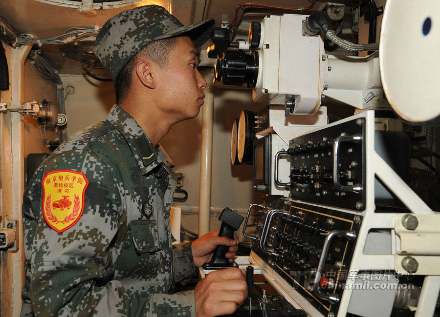 A cadet who will graduate from Langfang Barrack of Nanjing Artillery Academy of the Chinese People's Liberation Army (PLA) in a comprehensive live-ammunition tactical exercises in harsh conditions and complex environment. (China Military Online/Liu Fengan) 