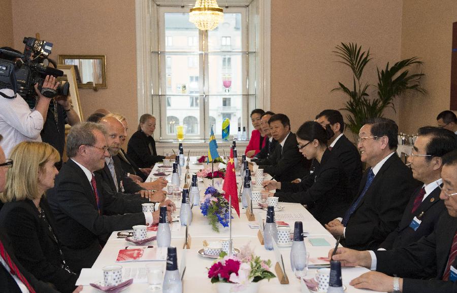 Yu Zhengsheng, chairman of the National Committee of the Chinese People's Political Consultative Conference, holds talks with Swedish Parliament Speaker Per Westerberg in Stockholm, Sweden, June 3, 2013. (Xinhua/Li Xueren)