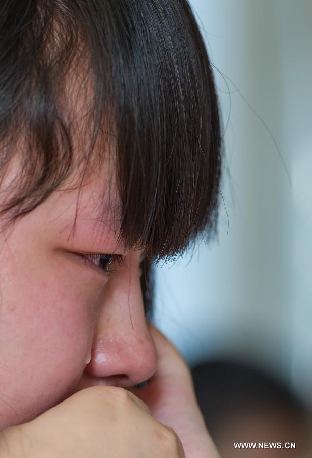 A student cries on the occasion of her graduation at the Yucai Middle School in Chongqing, southwest China, June 4, 2013. Three days later, the high school graduates will take part in the national college entrance exam, which is set for June 7 and 8. (Xinhua/Chen Cheng) 