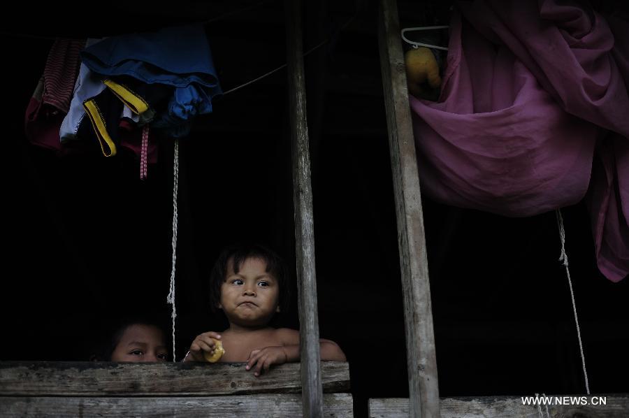 Children of the Embrea ethnic group rest in the Ella Puru Embrea community, outskirts of Panama's capital Panama City, on June 4, 2013. The Embrea and Wounaan indigenous groups are related to the environment through a economy based on agriculture, hunting, fishing and gathering, and now a days with small surplus for trade. The General Assembly of the United Nations (UN), declared June 5 as the World Environment Day. (Xinhua/Mauricio Valenzuela)