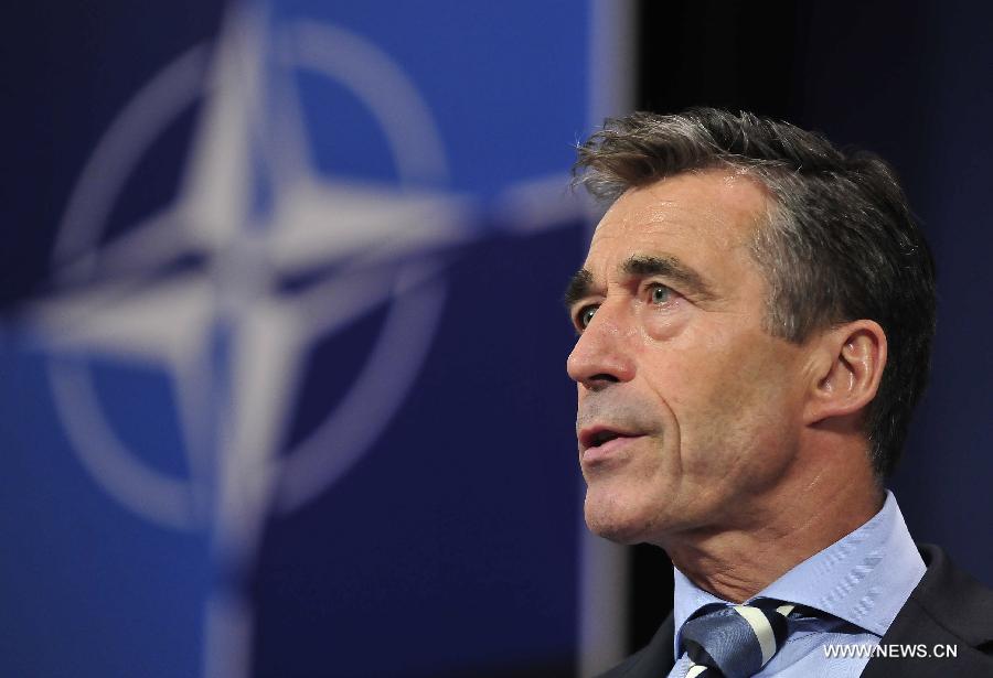 NATO Secretary General Anders Fogh Rasmussen addresses a press conference after two-days NATO Defence Ministers Meeting at its headquarters in Brussels, capital of Belgium, June 5, 2013. (Xinhua/Ye Pingfan)  