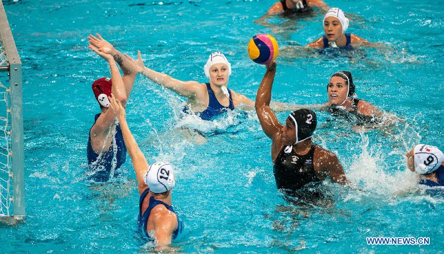 Alogbo Kkrystina (C) of Canada competes during the 2013 FINA Women's Water Polo World League Super Final classification 5-8 against Italy in Beijing, capital of China, June 5, 2013. Italy won 13-9. (Xinhua/Zhang Yu)
