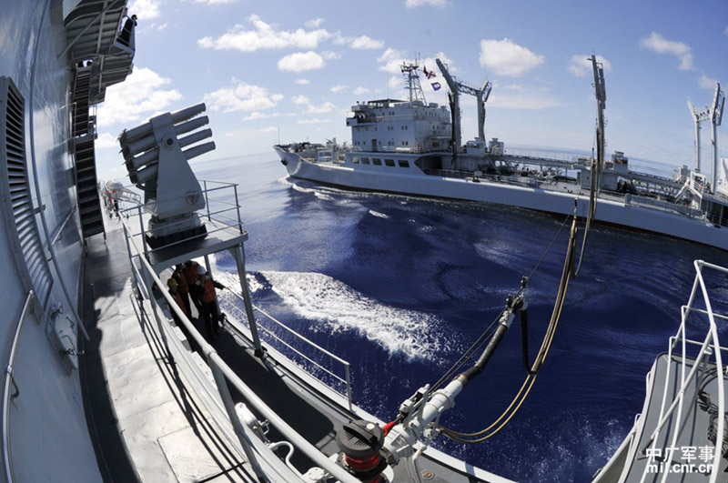 The high-sea training taskforce under the North China Sea Fleet of the Navy of the Chinese People's Liberation Army (PLAN) conducted comprehensive replenishment training in a sea area of the Western Pacific Ocean on June 1, 2013. It is the first time for the guided missile frigate "Linyi" to complete its replenishment during sailing since it was commissioned late last year. (mil.cnr.cn/Chen Zhong, Kong Xianglong and Zhang Gang)