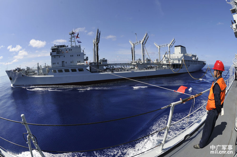 The high-sea training taskforce under the North China Sea Fleet of the Navy of the Chinese People's Liberation Army (PLAN) conducted comprehensive replenishment training in a sea area of the Western Pacific Ocean on June 1, 2013. It is the first time for the guided missile frigate "Linyi" to complete its replenishment during sailing since it was commissioned late last year. (mil.cnr.cn/Chen Zhong, Kong Xianglong and Zhang Gang)