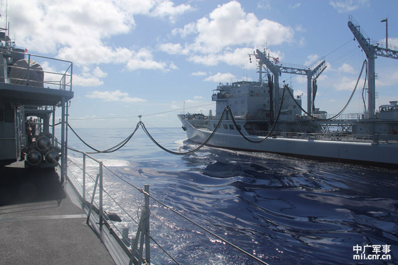 The high-sea training taskforce under the North China Sea Fleet of the Navy of the Chinese People's Liberation Army (PLAN) conducted comprehensive replenishment training in a sea area of the Western Pacific Ocean on June 1, 2013. It is the first time for the guided missile frigate "Linyi" to complete its replenishment during sailing since it was commissioned late last year. (mil.cnr.cn/Chen Zhong, Kong Xianglong and Zhang Gang)