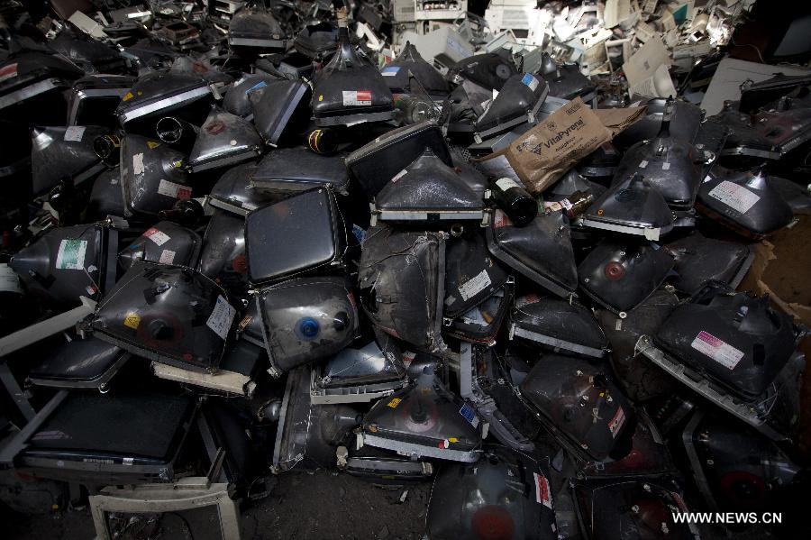 Waste material ramains stacked on a warehouse property of "La Toma" cooperative, a group that performs electronic waste recycling during the World Environment Day, in Dock Sud, Argentina, on June 5, 2013. The cooperative, created on 1972, gives work to 20 low-income people, mostly youngsters. The World Environment Day is celebrated yearly on June 5 to create awareness in relation to environmental issues. (Xinhua/Martin Zabala) 