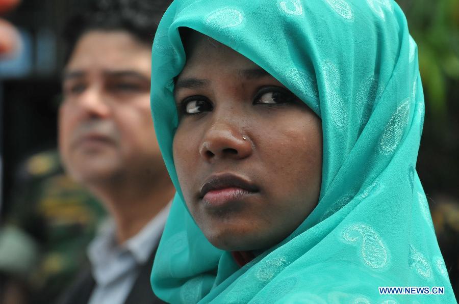 Reshma, a young female garment worker, attends a press conference in a hospital in Savar on the outskirts of Dhaka, Bangladesh, June 6, 2013. Miraculous Bangladeshi building collapse survivor Reshma will join Starwood Hotels and Resorts Worldwide, one of the top global hotel chains, as an ambassador, officials said Thursday. Eight-storey building Rana Plaza collapsed in Savar on the outskirts of the capital Dhaka on April 24, leaving at least 1,127 people dead. (Xinhua/Shariful Islam)