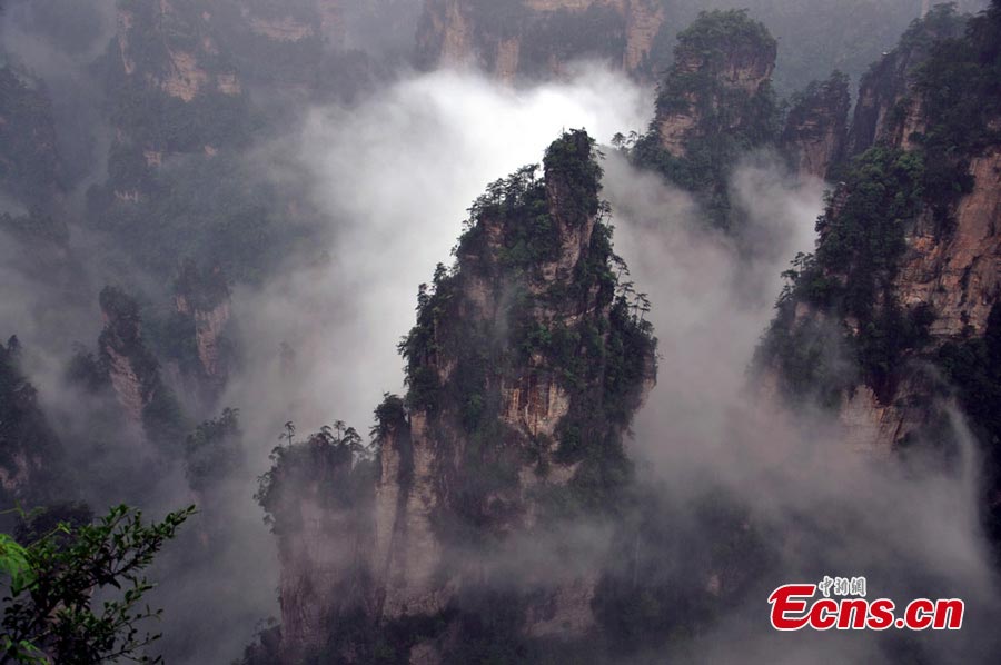 Photo taken on June 6, 2013 shows the scenery of Zhangjiajie National Forest Park in Zhangjiajie, Central China's Hunan Province. Heavy rain hit the area on Thursday. (CNS/Deng Daoli)