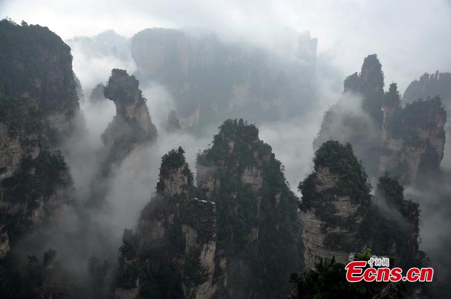 Photo taken on June 6, 2013 shows the scenery of Zhangjiajie National Forest Park in Zhangjiajie, Central China's Hunan Province. Heavy rain hit the area on Thursday. (CNS/Deng Daoli)