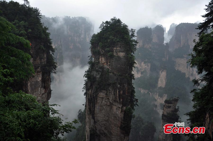 Photo taken on June 6, 2013 shows the scenery of Zhangjiajie National Forest Park in Zhangjiajie, Central China's Hunan Province. Heavy rain hit the area on Thursday. (CNS/Deng Daoli)