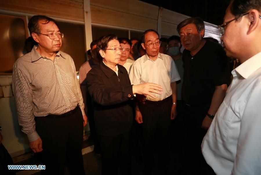 Chinese State Councilor and Public Security Minister Guo Shengkun (2nd L, front) investigates at the accident site in Xiamen, capital of southeast China's Fujian Province, June 8, 2013. The State Council, China's cabinet, has sent a work team led by Guo to Xiamen to oversee the investigation of the bus fire that has claimed 47 lives and hospitalized 34 on Friday evening. (Xinhua/Zhang Jianxin) 