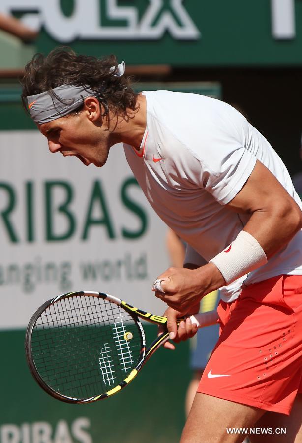 Rafael Nadal of Spain celebrates during the men's singles semi-final match against Novak Djokovic of Serbia at the French Open tennis tournament in Paris June 7, 2013. Nadal won 3-2. (Xinhua/Gao Jing)