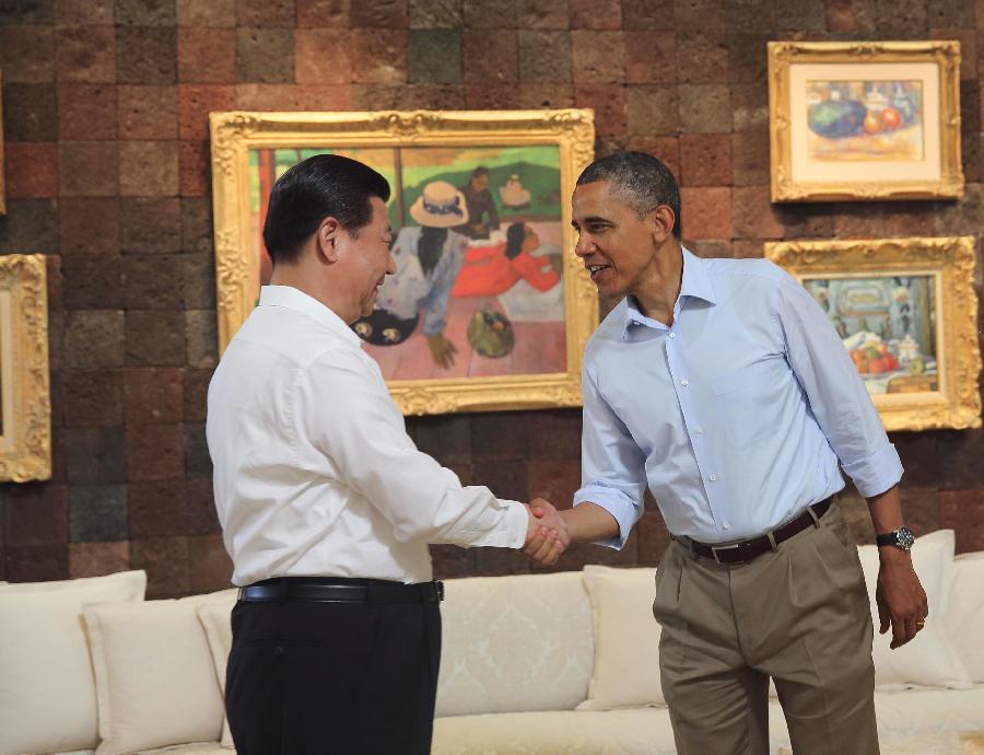 U.S. President Barack Obama (R) welcomes Chinese President Xi Jinping to join a walk before heading into their second meeting, at the Annenberg Retreat, California, the United States, June 8, 2013. Chinese President Xi Jinping and U.S. President Barack Obama held the second meeting here on Saturday to exchange views on economic ties. (Xinhua/Lan Hongguang)