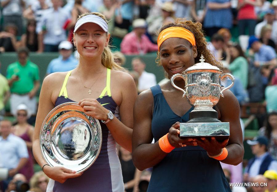 Serena Williams of the United States celebrates after winning the women's singles final match against Maria Sharapova of Russia at the French Open tennis tournament in Paris June 8, 2013. Serena Williams won the match 2-0 to claim the title. (Xinhua/Gao Jing)