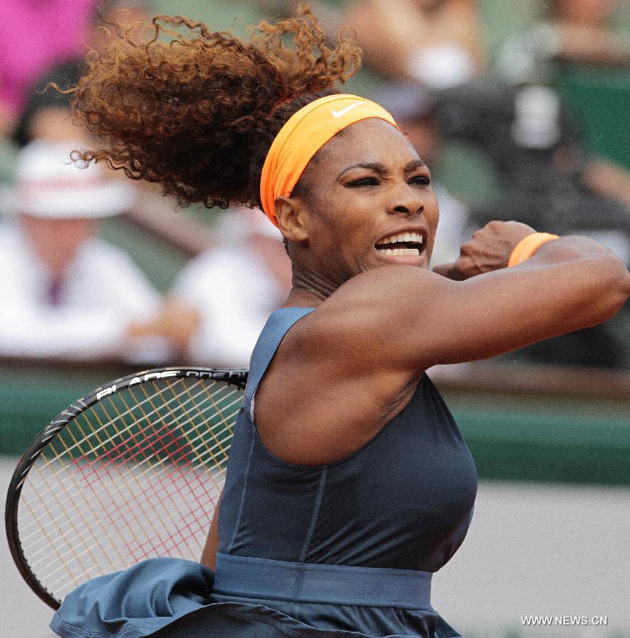 Serena Williams of the United States celebrates after winning the women's singles final match against Maria Sharapova of Russia at the French Open tennis tournament in Paris June 8, 2013. Serena Williams won the match 2-0 to claim the title. (Xinhua/Gao Jing)