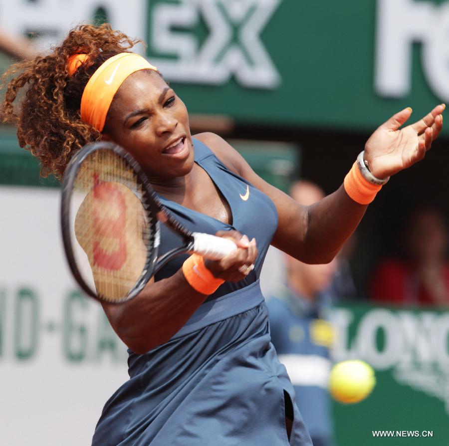 Serena Williams of the United States celebrates after winning the women's singles final match against Maria Sharapova of Russia at the French Open tennis tournament in Paris June 8, 2013. Serena Williams won the match 2-0 to claim the title. (Xinhua/Gao Jing)