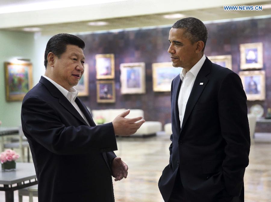 Chinese President Xi Jinping (L) talks with U.S. President Barack Obama after their meeting at the Annenberg Retreat, California, the United States, June 7, 2013. (Xinhua/Lan Hongguang) 