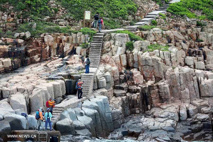 Tourists visit the North Ninepin Island in Hong Kong, south China, June 9, 2013. The Ninepin Group, or Kwo Chau Islands, is a group of islands in the southeastern Hong Kong. (Xinhua/Li Peng) 