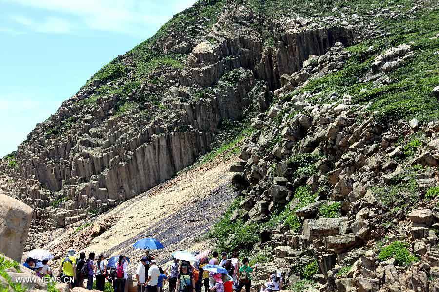 Tourists visit the North Ninepin Island in Hong Kong, south China, June 9, 2013. The Ninepin Group, or Kwo Chau Islands, is a group of islands in the southeastern Hong Kong. (Xinhua/Li Peng) 