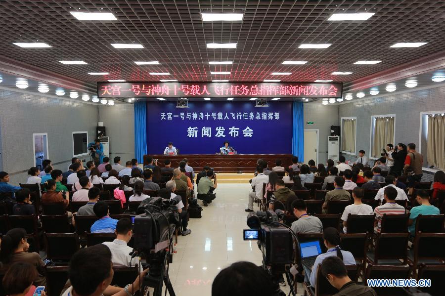 A press conference to brief on the launch of the Shenzhou-10 manned spacecraft is held by China's space program headquarters at the Jiuquan Satellite Launch Center in Jiuquan, northwest China's Gansu Province, June 10, 2013. (Xinhua/Li Gang) 