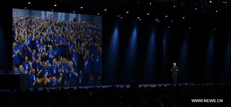 Apple CEO Tim Cook addresses the 2013 Apple WWDC at the Moscone Center in San Francisco, California, the United States, on June 10, 2013. (Xinhua)