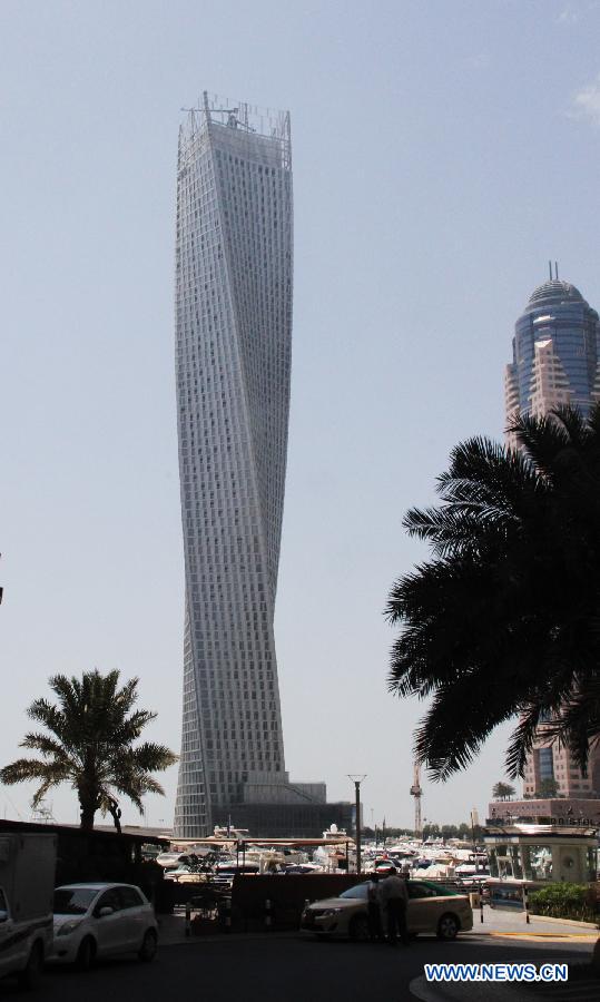 Photo taken on June 10, 2013 shows the Cayan Tower in Dubai's prestigious Marina district, the United Arab Emirates (UAE). Saudi developer Cayan inaugurated late Monday the opening of the 73-storey, 310-meter-high Cayan Tower in Dubai's prestigious Marina district. (Xinhua/Li Zhen) 