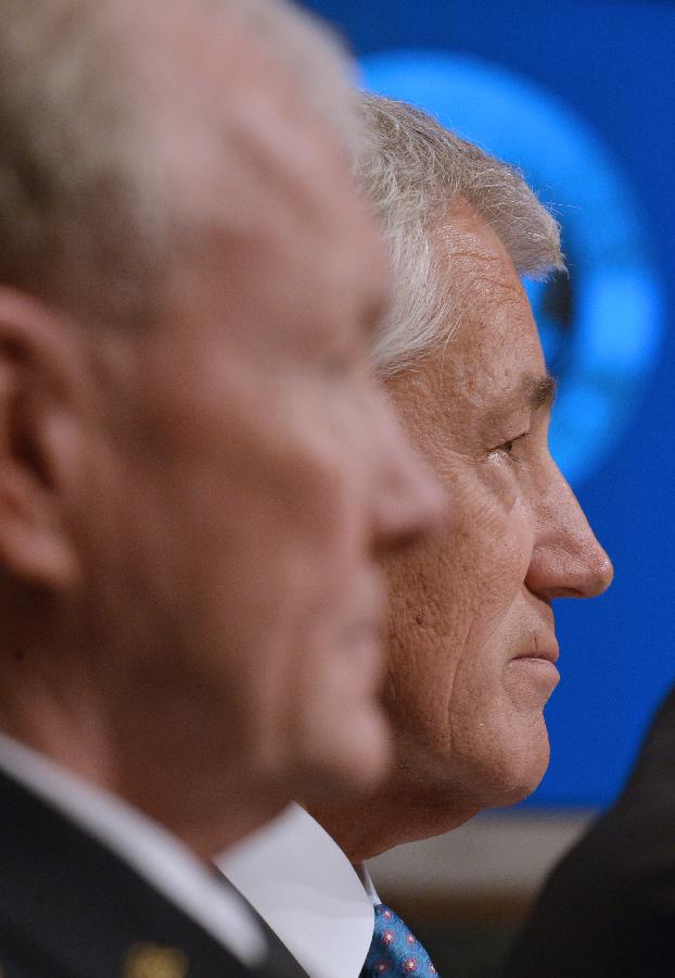 Chuck Hagel (R), U.S. Secretary of Defense and Martin Dempsey, Chairman of Joint Chiefs of Staff, testify before the U.S. Senate Budget Committee about U.S. President Barrack Obama's proposed budget request for fiscal year 2014 for defense, on Capitol Hill in Washington D.C., capital of the United States, June 12, 2013. (Xinhua/Zhang Jun) 