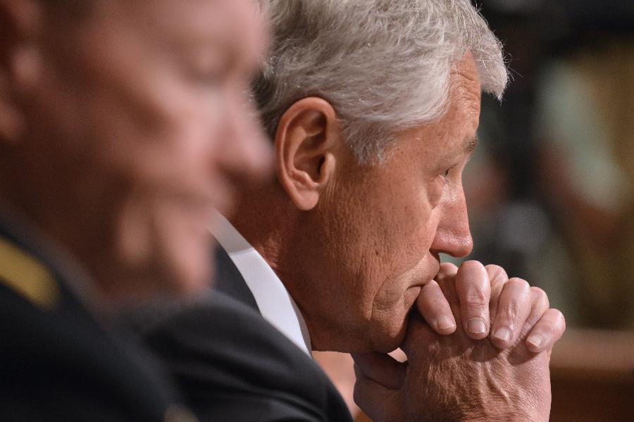 Chuck Hagel (R), U.S. Secretary of Defense and Martin Dempsey, Chairman of Joint Chiefs of Staff, testify before the U.S. Senate Budget Committee about U.S. President Barrack Obama's proposed budget request for fiscal year 2014 for defense, on Capitol Hill in Washington D.C., capital of the United States, June 12, 2013. (Xinhua/Zhang Jun) 