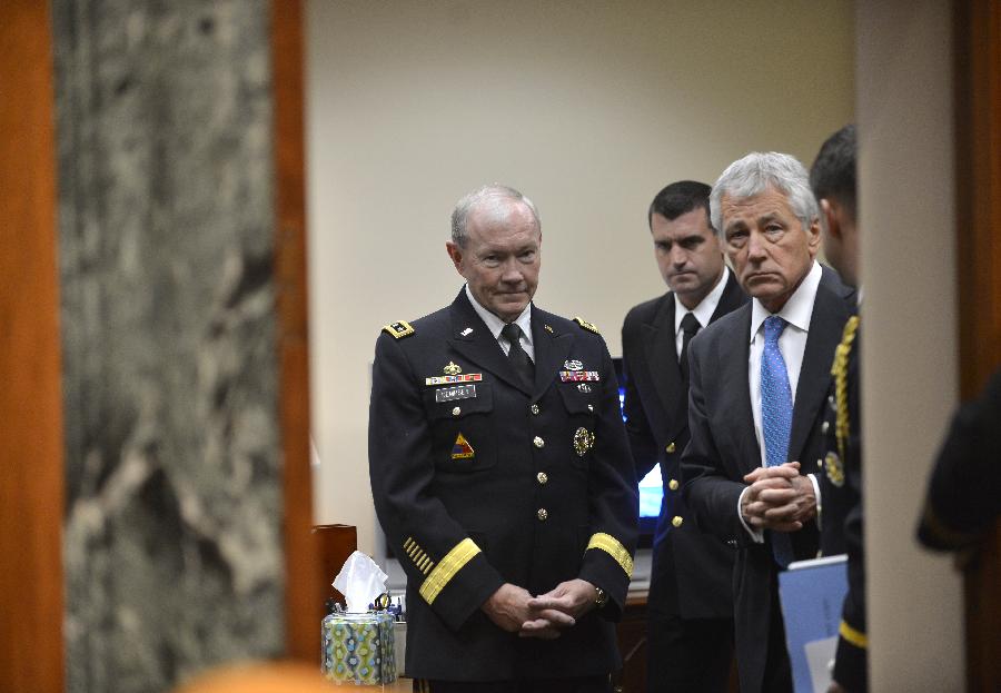 Chuck Hagel (R), U.S. Secretary of Defense and Martin Dempsey (L), Chairman of Joint Chiefs of Staff, wait to testify before the U.S. Senate Budget Committee about U.S. President Barrack Obama's proposed budget request for fiscal year 2014 for defense, on Capitol Hill in Washington D.C., capital of the United States, June 12, 2013. (Xinhua/Zhang Jun) 