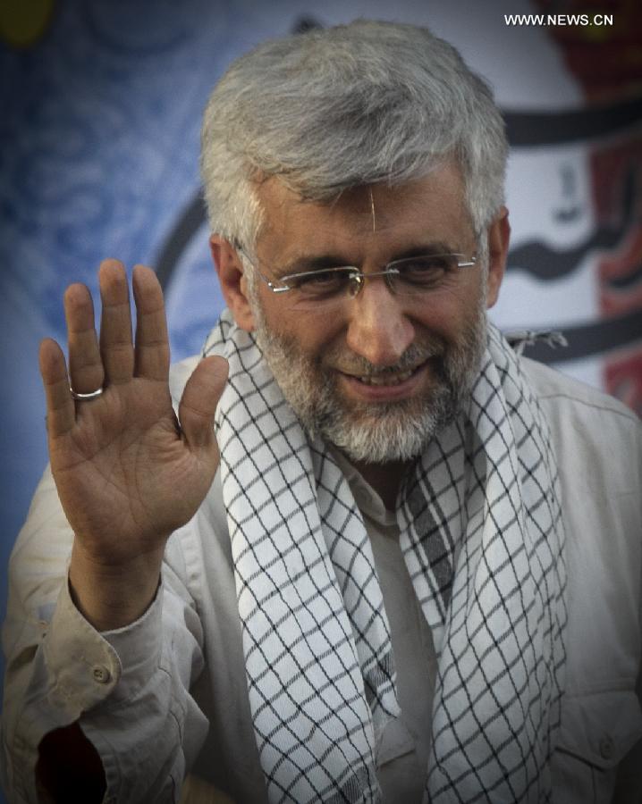 Iran's chief nuclear negotiator and presidential candidate Saeed Jalili waves to supporters in his campaign rally in downtown Tehran, Iran, on June 12, 2013. Iran's 11th presidential election is scheduled for June 14. (Xinhua/Ahmad Halabisaz)