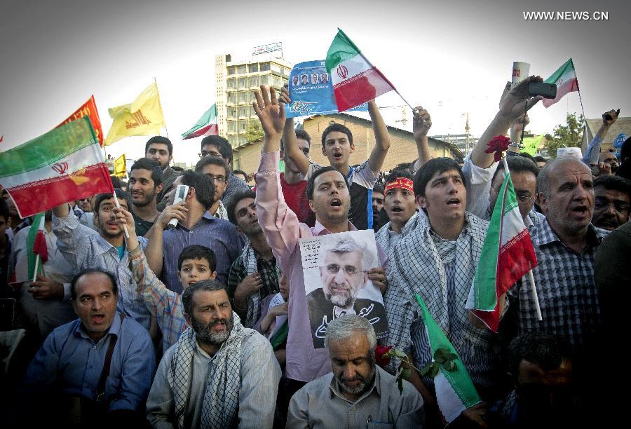 Supporters of Iran's chief nuclear negotiator and presidential candidate Saeed Jalili participate in his campaign rally in downtown Tehran, Iran, on June 12, 2013. Iran's 11th presidential election is scheduled for June 14. (Xinhua/Ahmad Halabisaz)