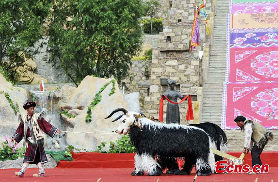 People of the Qiang ethnic group celebrate Wari'ezu Festival in Maoxian County, Southwest China's Sichuan Province, June 12, 2013. For thousands of years, there has been a convention among Qiang people, namely, to offer sacrifices to Sister Salang, the Goddess of Dance and Song. Every three years, Qiang people will get together and hold Wari'ezuconventional activities from May 3rd to May 5th in the lunar calendar. Since it is the only convention for Qiang females, it is also named by local people as Women's Day. (CNS/An Yuan)