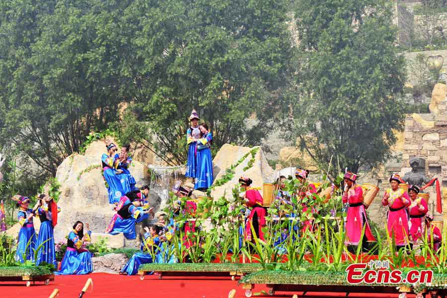 People of the Qiang ethnic group celebrate Wari'ezu Festival in Maoxian County, Southwest China's Sichuan Province, June 12, 2013. For thousands of years, there has been a convention among Qiang people, namely, to offer sacrifices to Sister Salang, the Goddess of Dance and Song. Every three years, Qiang people will get together and hold Wari'ezuconventional activities from May 3rd to May 5th in the lunar calendar. Since it is the only convention for Qiang females, it is also named by local people as Women's Day. (CNS/An Yuan)