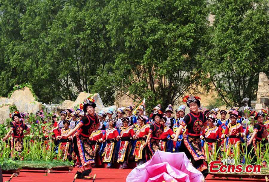 People of the Qiang ethnic group celebrate Wari'ezu Festival in Maoxian County, Southwest China's Sichuan Province, June 12, 2013. For thousands of years, there has been a convention among Qiang people, namely, to offer sacrifices to Sister Salang, the Goddess of Dance and Song. Every three years, Qiang people will get together and hold Wari'ezuconventional activities from May 3rd to May 5th in the lunar calendar. Since it is the only convention for Qiang females, it is also named by local people as Women's Day. (CNS/An Yuan)