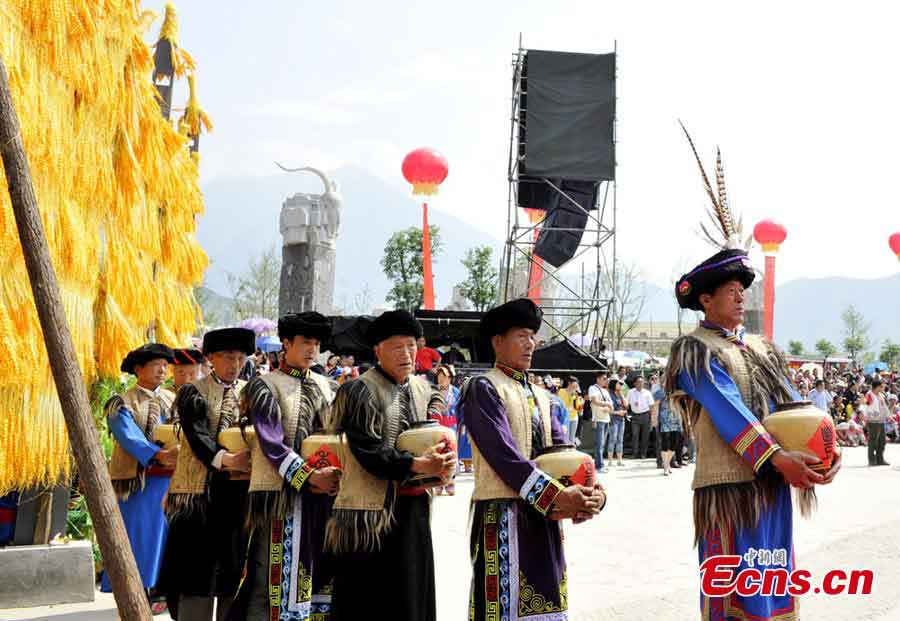 People of the Qiang ethnic group celebrate Wari'ezu Festival in Maoxian County, Southwest China's Sichuan Province, June 12, 2013. For thousands of years, there has been a convention among Qiang people, namely, to offer sacrifices to Sister Salang, the Goddess of Dance and Song. Every three years, Qiang people will get together and hold Wari'ezuconventional activities from May 3rd to May 5th in the lunar calendar. Since it is the only convention for Qiang females, it is also named by local people as Women's Day. (CNS/An Yuan)