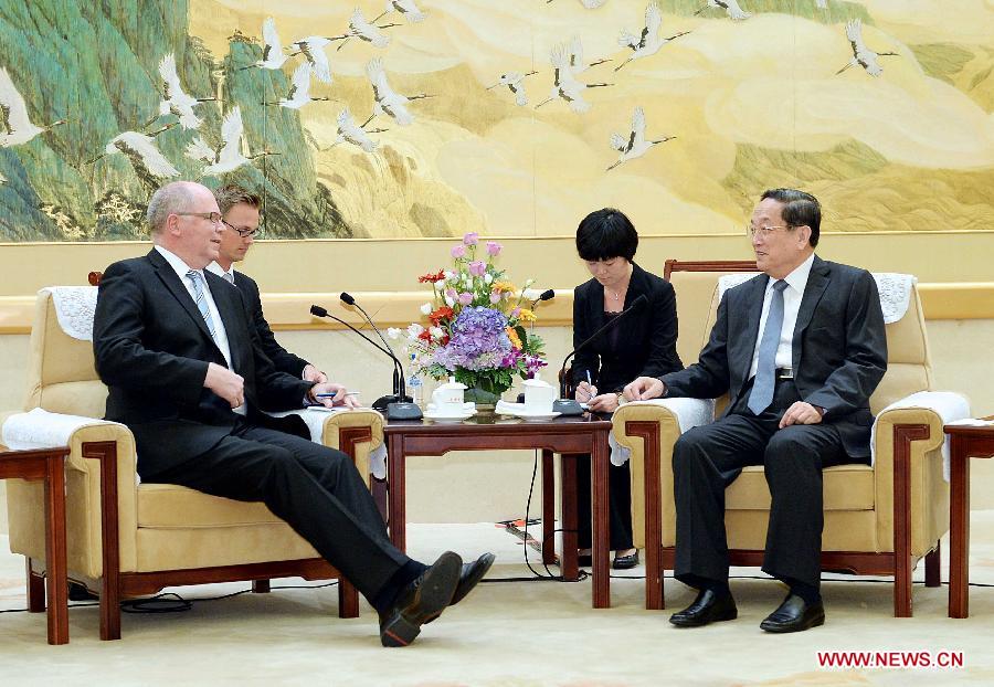 Yu Zhengsheng (R), chairman of the National Committee of the Chinese People's Political Consultative Conference (CPPCC), meets with Finnish Parliament Speaker Eero Heinaluoma in Beijing, capital of China, June 13, 2013. (Xinhua/Li Tao) 