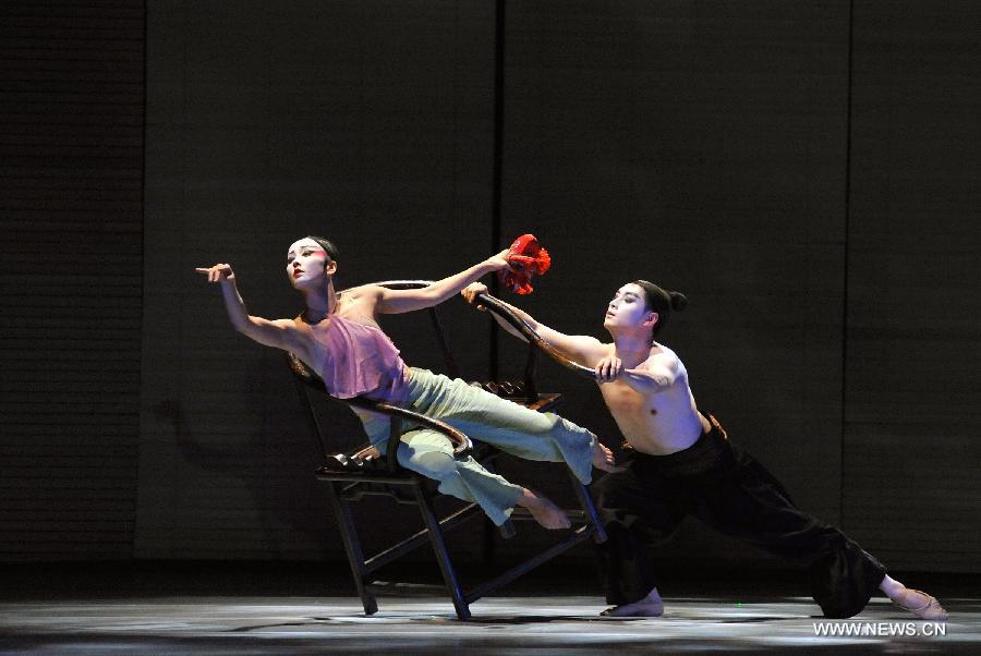 Performers of the Beijing 9 Dance Theater play the dance Dreams of Zen during a trial performance in Beijing, China, June 13, 2013. Created by director Zhao Liang, the dance drama is inspired by one of the most studied Chinese novels Dream of the Red Chamber, and it will be officially staged in Beijing on June 28 - 30. (Xinhua/Li Yan)