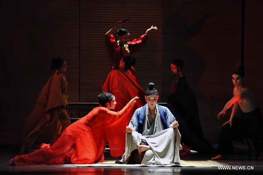 Performers of the Beijing 9 Dance Theater play the dance Dreams of Zen during a trial performance in Beijing, China, June 13, 2013. Created by director Zhao Liang, the dance drama is inspired by one of the most studied Chinese novels Dream of the Red Chamber, and it will be officially staged in Beijing on June 28 - 30. (Xinhua/Li Yan)