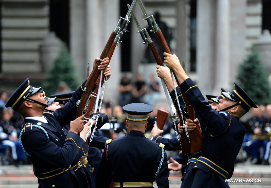 The U.S. Army Drill Team members perform at United States Army 238th Birthday Celebration during the Army Week which made up of veterans, reservists, military spouses and committed community members, in New York, the United States, June 14, 2013. (Xinhua/Wang Lei)