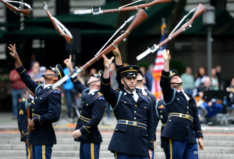 The U.S. Army Drill Team members perform at United States Army 238th Birthday Celebration during the Army Week which made up of veterans, reservists, military spouses and committed community members, in New York, the United States, June 14, 2013. (Xinhua/Wang Lei)