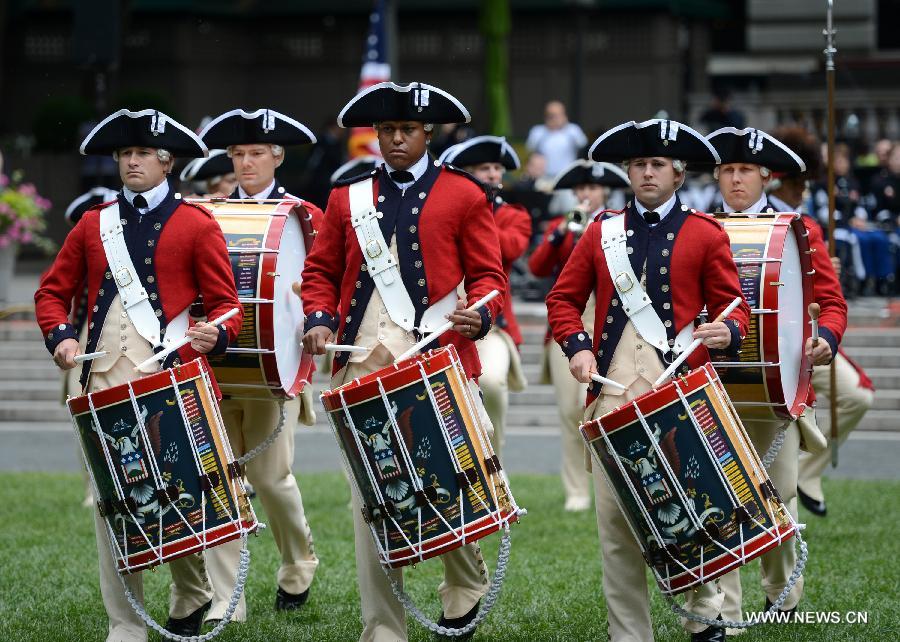 Drum Corps members attend United States Army 238th Birthday Celebration during the Army Week which made up of veterans, reservists, military spouses and committed community members, in New York, the United States, June 14, 2013. (Xinhua/Wang Lei)