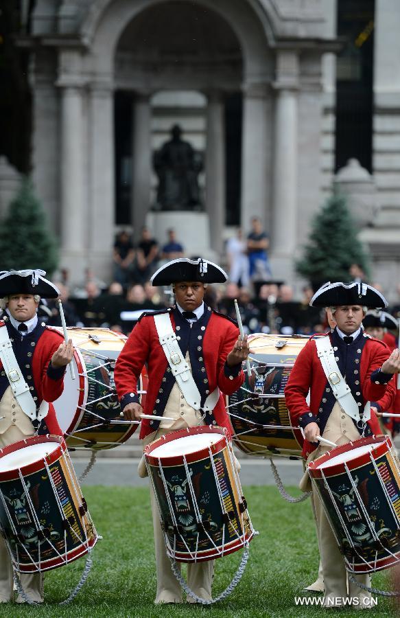 Drum Corps members attend United States Army 238th Birthday Celebration during the Army Week which made up of veterans, reservists, military spouses and committed community members, in New York, the United States, June 14, 2013. (Xinhua/Wang Lei)