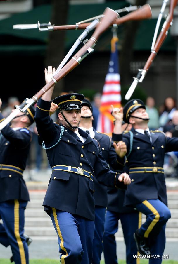 The U.S. Army Drill Team members perform at United States Army 238th Birthday Celebration during the Army Week which made up of veterans, reservists, military spouses and committed community members, in New York, the United States, June 14, 2013. (Xinhua/Wang Lei)