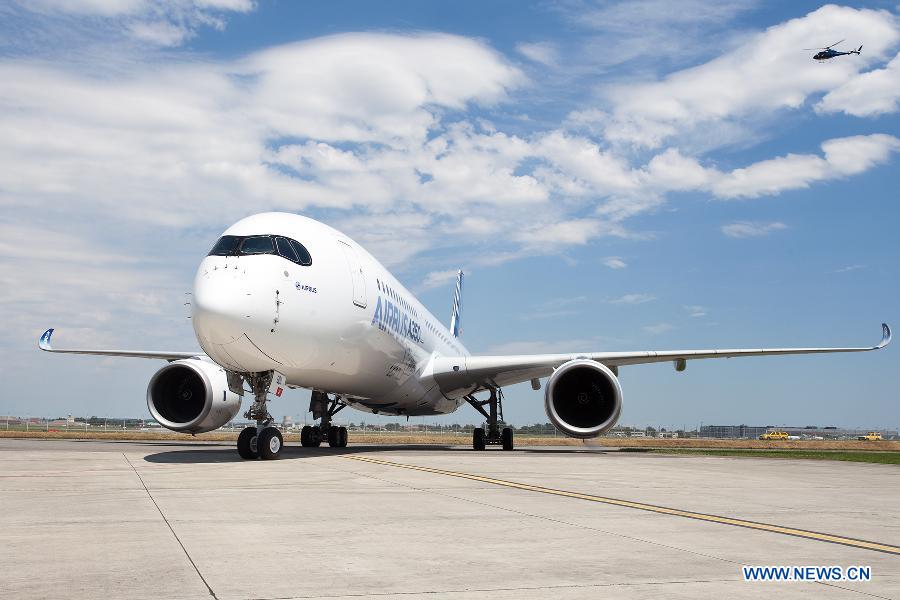 Airbus's A350 XWB (eXtra Wide Body) plane is seen after landing at the Toulouse-Blagnac airport, southwestern France, on June 14, 2013. After its first four-hour test flight, the A350 XWB plane landed safely in southern France on Friday. (Xinhua/Chen Cheng)