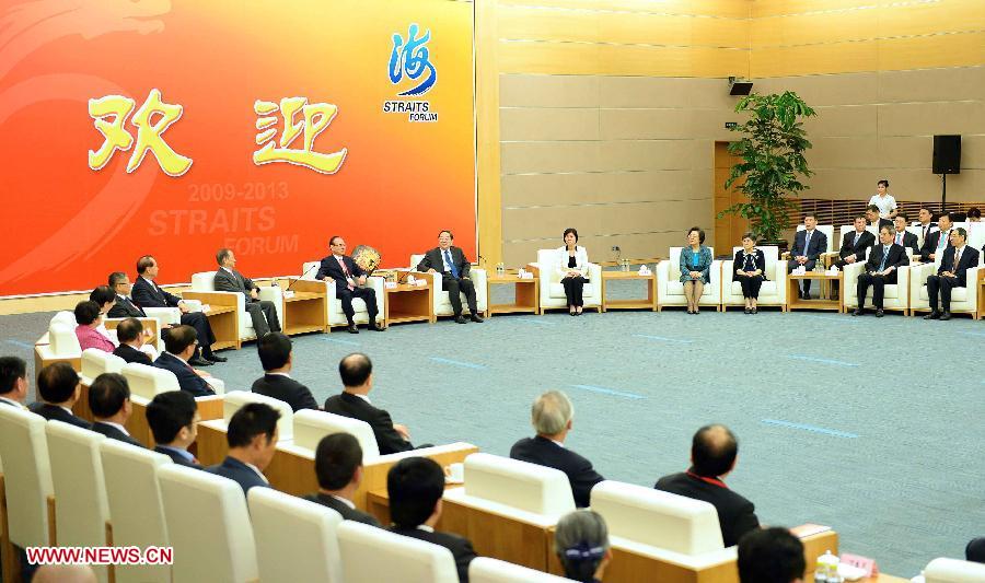 Yu Zhengsheng, a member of the Standing Committee of the Political Bureau of the Communist Party of China (CPC) Central Committee and chairman of the National Committee of the Chinese People's Political Consultative Conference, meets with personages from both the mainland and Taiwan at the 5th Straits Forum in Xiamen, southeast China's Fujian Province, June 15, 2013. (Xinhua/Li Tao) 